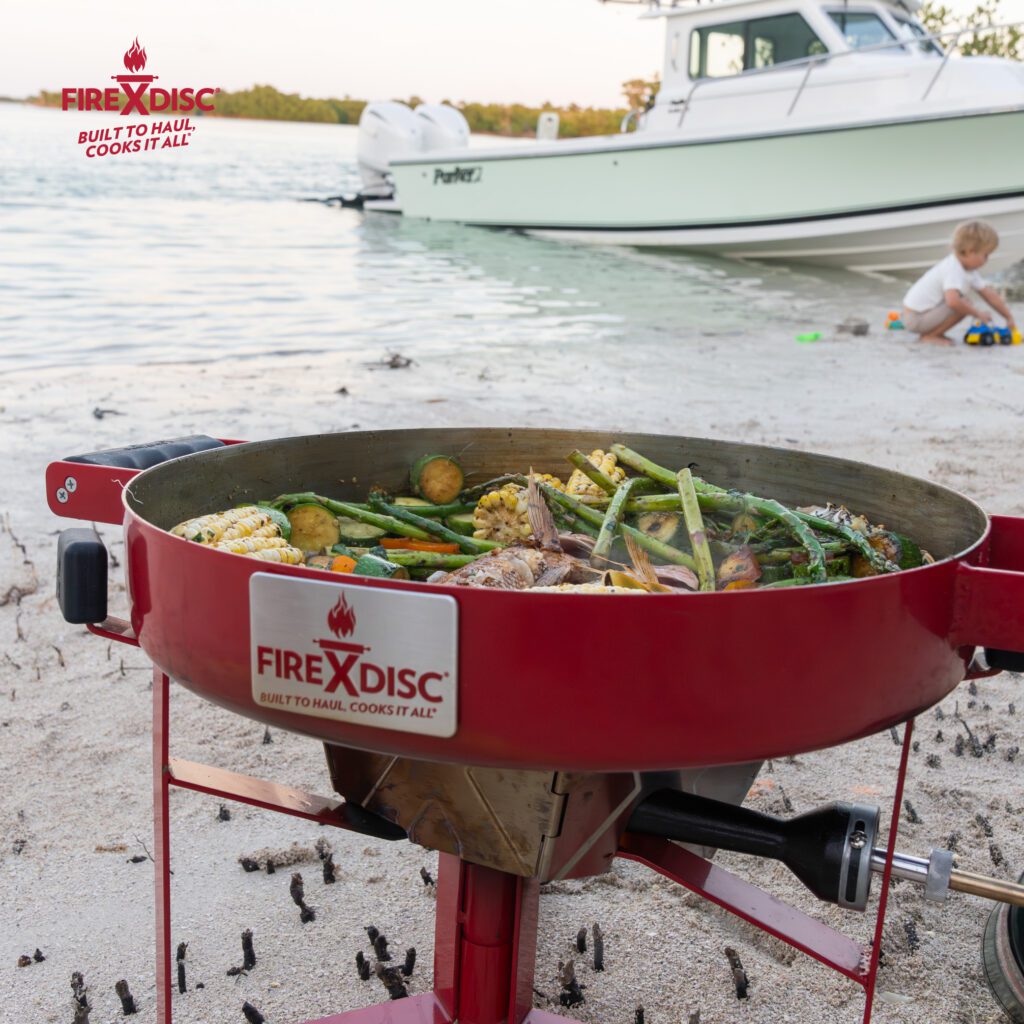 The All-New FIREDISC Drifter. The Ultimate Portable Disc Cooker for Any Adventure 1 Cook by the beach
